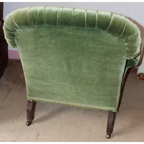 3203 - THIS ITEM IS NOT HELD BY PFW. A green upholstered low chair on castors, 85cm wide, 80cm deep, 84cm h... 