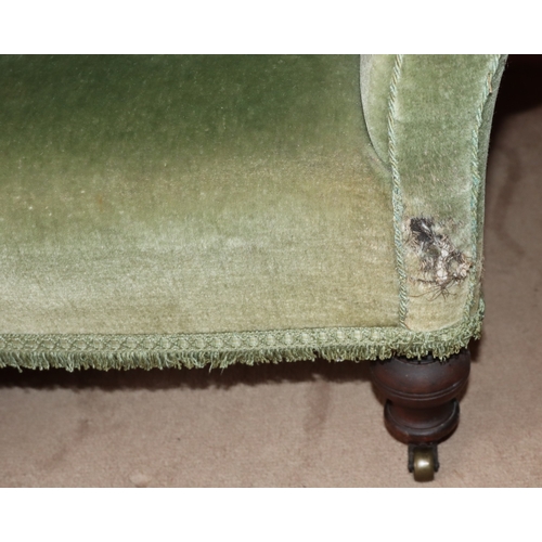 3203 - THIS ITEM IS NOT HELD BY PFW. A green upholstered low chair on castors, 85cm wide, 80cm deep, 84cm h... 