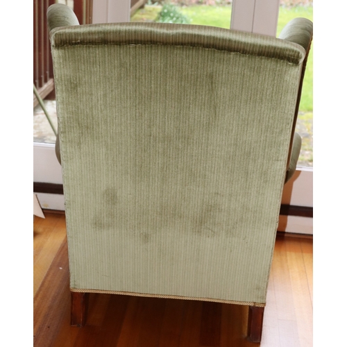 3225 - THIS ITEM IS NOT HELD BY PFW. A wing back green upholstered armchair, 76cm wide, 69cm deep, 97cm hig... 