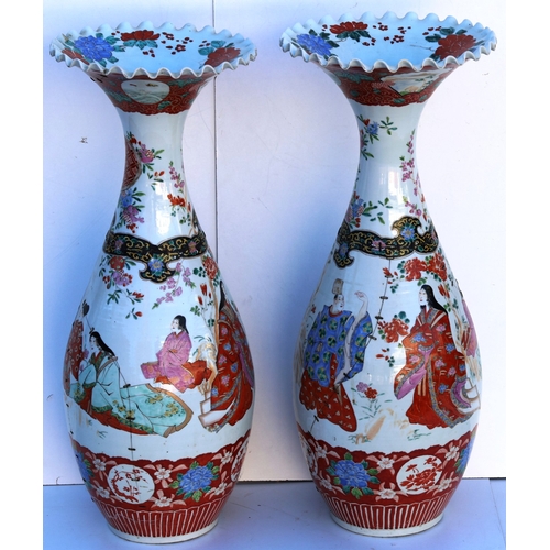 103 - A pair of large round bulbous thin necked trumpet shaped floor vases with crinkled rims, on white gr... 