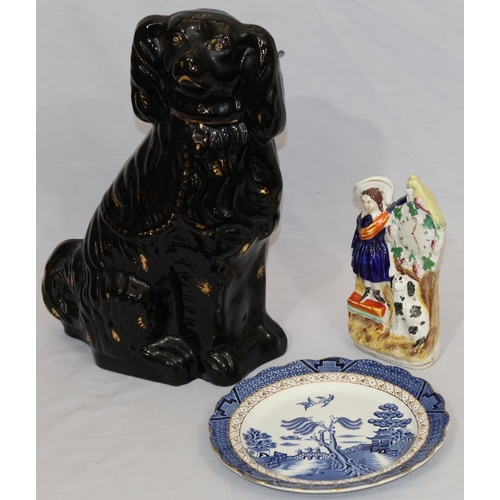 104 - A Victorian black Staffordshire large china figure of a seated Spaniel with gilt decoration, 35cm hi... 