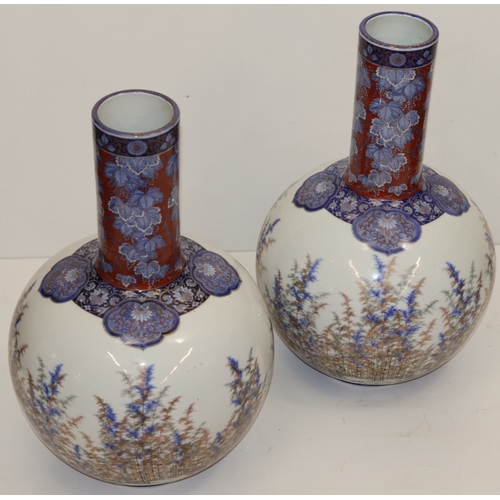 106 - A pair of large Japanese round bulbous thin necked vases with multi-coloured fish, landscape, floral... 