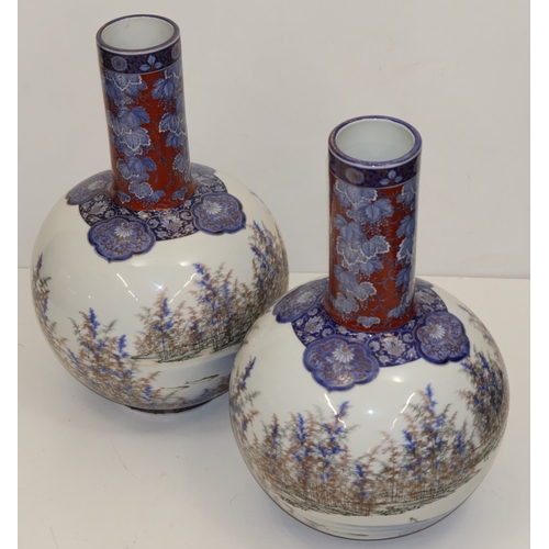 106 - A pair of large Japanese round bulbous thin necked vases with multi-coloured fish, landscape, floral... 