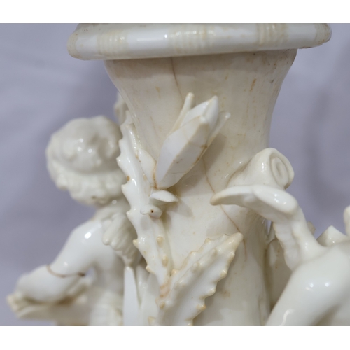 107 - A Moore Brothers white china round bulbous shaped oil lamp with allover raised cupid, floral, leaf a... 