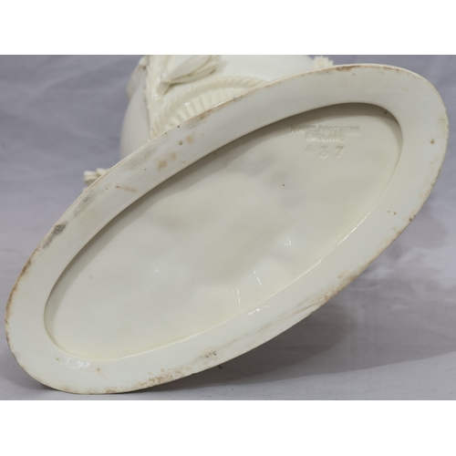 107 - A Moore Brothers white china round bulbous shaped oil lamp with allover raised cupid, floral, leaf a... 