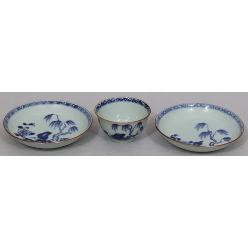 66 - An 18th Century Chinese tea bowl on blue and white ground and 2 matching saucers with branch, floral... 