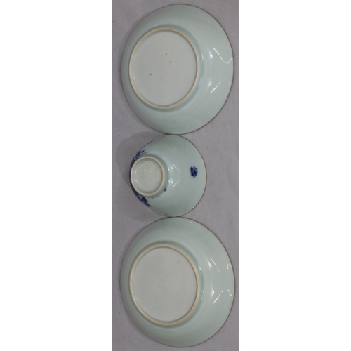 66 - An 18th Century Chinese tea bowl on blue and white ground and 2 matching saucers with branch, floral... 