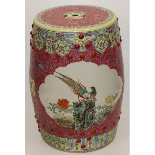 67 - An Oriental large round bulbous shaped garden seat on pink and yellow ground, panels with multi-colo... 