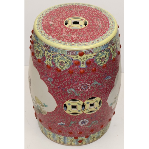 67 - An Oriental large round bulbous shaped garden seat on pink and yellow ground, panels with multi-colo... 