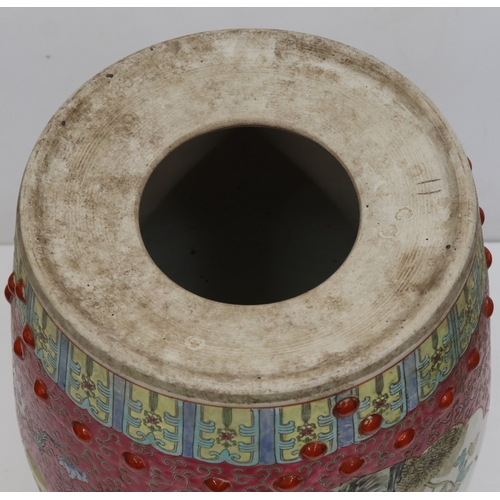 67 - An Oriental large round bulbous shaped garden seat on pink and yellow ground, panels with multi-colo... 