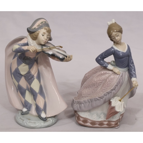 72 - A Lladro figure of a young standing lady holding a parasol, 18cm high and another Lladro figure of a... 