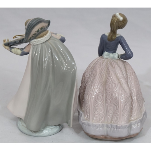 72 - A Lladro figure of a young standing lady holding a parasol, 18cm high and another Lladro figure of a... 