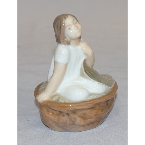 86 - A Royal Copenhagen small figure of a young girl seated in a basket holding a large leaf no. 4374, 9c... 