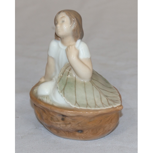 86 - A Royal Copenhagen small figure of a young girl seated in a basket holding a large leaf no. 4374, 9c... 