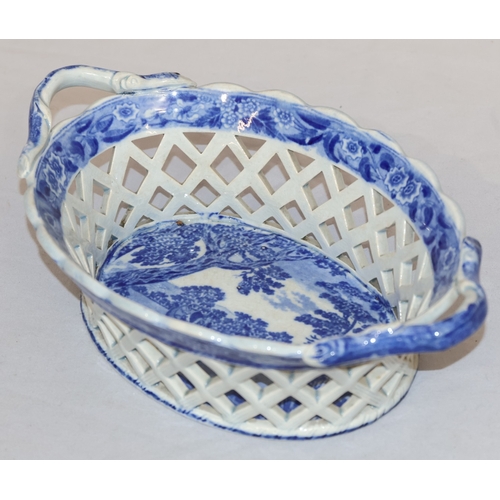 88 - A 19th Century oval blue and white 2-handled basket with figure on horseback and landscape decoratio... 
