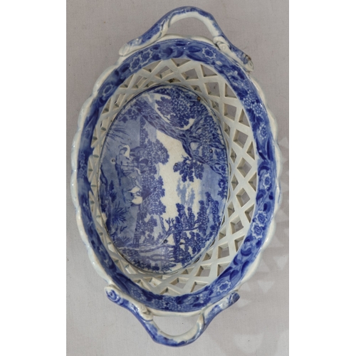 88 - A 19th Century oval blue and white 2-handled basket with figure on horseback and landscape decoratio... 