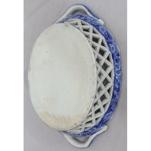 88 - A 19th Century oval blue and white 2-handled basket with figure on horseback and landscape decoratio... 