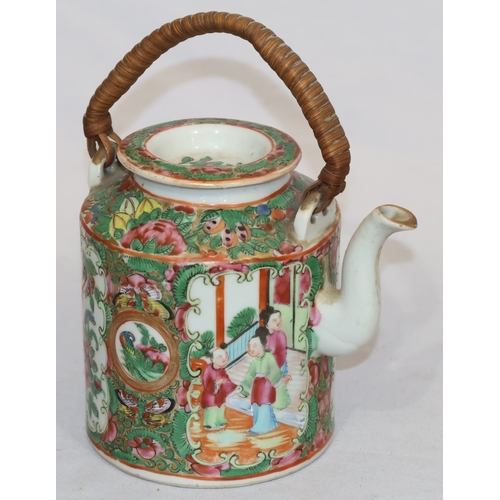 89 - A Cantonese round teapot with cover, wicker overhead handle, allover figure, bird, butterfly, floral... 