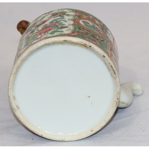 89 - A Cantonese round teapot with cover, wicker overhead handle, allover figure, bird, butterfly, floral... 