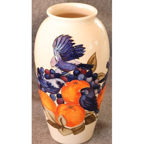 95 - A Moorcroft round bulbous thin necked trumpet shaped Finches and Fruit pattered vase, 25.5cm high