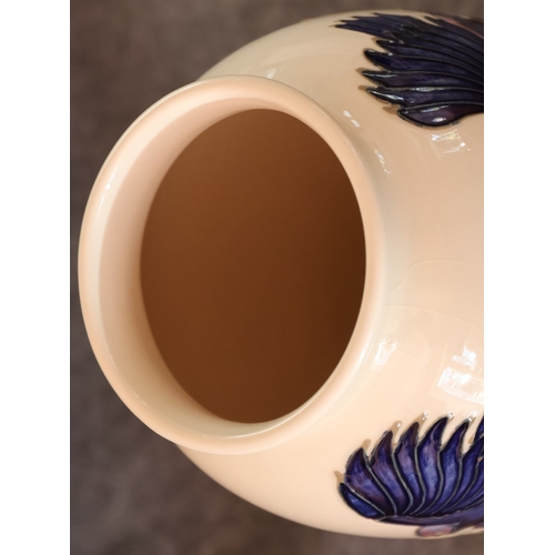 95 - A Moorcroft round bulbous thin necked trumpet shaped Finches and Fruit pattered vase, 25.5cm high