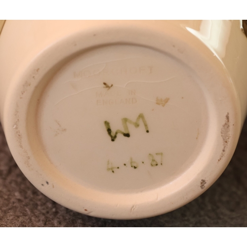 95 - A Moorcroft round bulbous thin necked trumpet shaped Finches and Fruit pattered vase, 25.5cm high