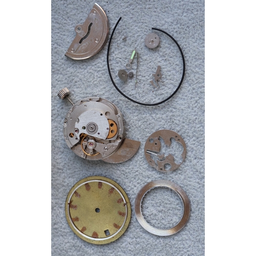 4308 - A Tag Heuer style watch face and part movement (no case), with Tag travelling watch case