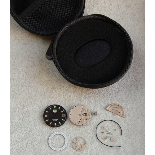 4308 - A Tag Heuer style watch face and part movement (no case), with Tag travelling watch case