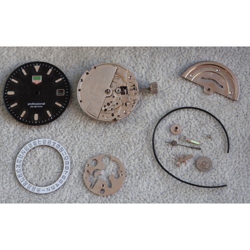 4308 - A Tag Heuer style watch face and part movement (no case), with Tag travelling watch case
