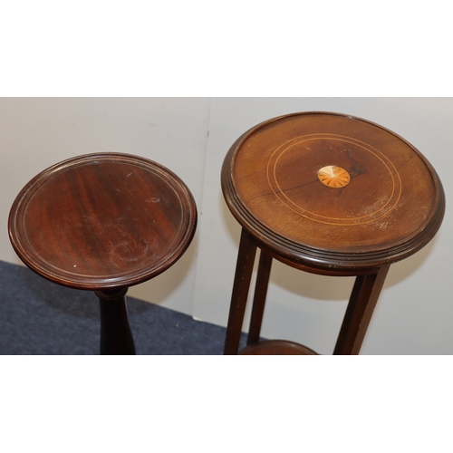 4002 - A mahogany torchiere, top, 29.5cm diameter, 94cm tall and another torchiere with inlaid detail to to... 