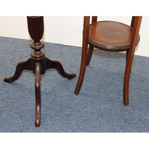 4002 - A mahogany torchiere, top, 29.5cm diameter, 94cm tall and another torchiere with inlaid detail to to... 