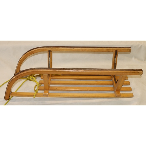 4069 - A vintage wooden Criterion Davos 2-man sledge, Stock No. 05-35.