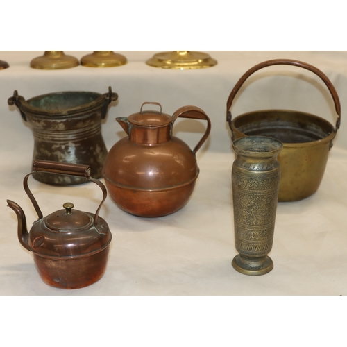 4070 - A quantity of various brass and copper, including a tall candlestick, 45cm high, a pair of candlesti... 