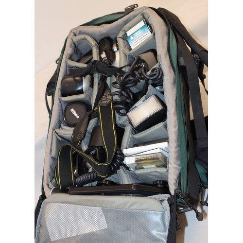 4072 - A large Lowepro camera rucksack with interior compartments, a Nikon F80 camera, No.2075641 (no lens)... 