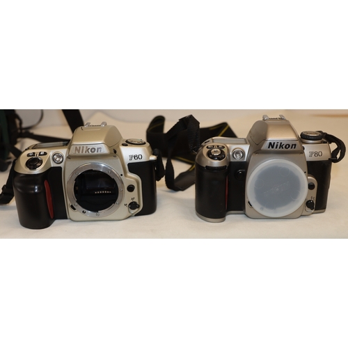 4072 - A large Lowepro camera rucksack with interior compartments, a Nikon F80 camera, No.2075641 (no lens)... 