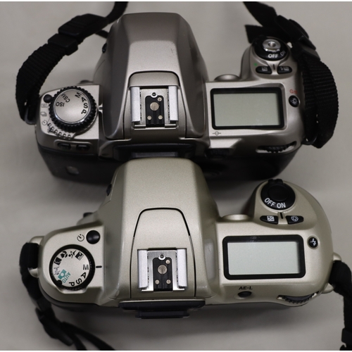 4072 - A large Lowepro camera rucksack with interior compartments, a Nikon F80 camera, No.2075641 (no lens)... 