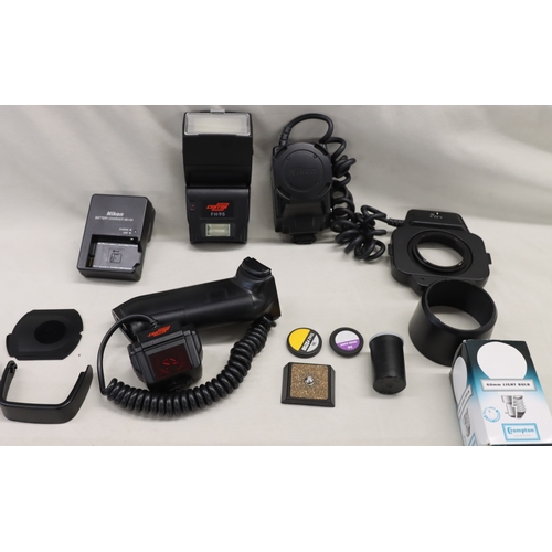 4072 - A large Lowepro camera rucksack with interior compartments, a Nikon F80 camera, No.2075641 (no lens)... 