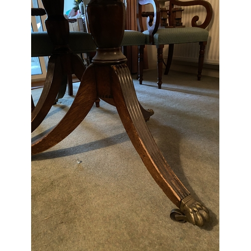 4082 - THIS ITEM IS NOT HELD BY PFW. A mahogany D-end extending dining table on brass claw feet with castor... 