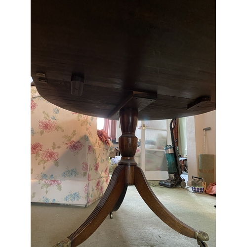 4082 - THIS ITEM IS NOT HELD BY PFW. A mahogany D-end extending dining table on brass claw feet with castor... 