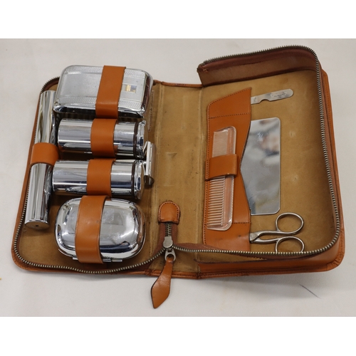 4094 - A 3-light lamp, 55.5cm high and a tan leather gentleman's travel vanity case with chromium plated co... 