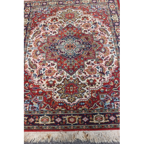 4096 - A Belgian machine made wool rug, 122cm x 168cm (some marks).