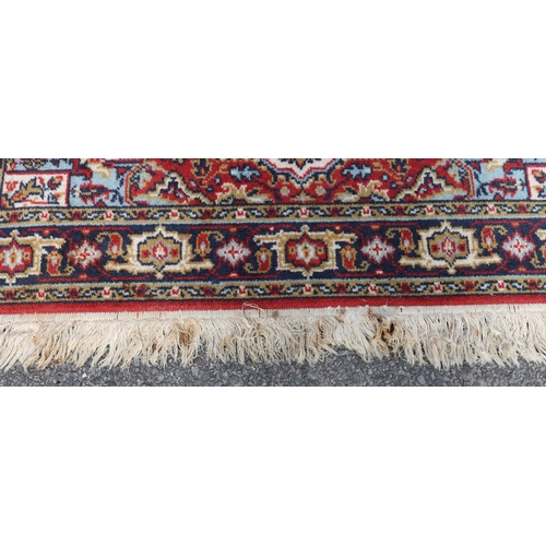 4096 - A Belgian machine made wool rug, 122cm x 168cm (some marks).