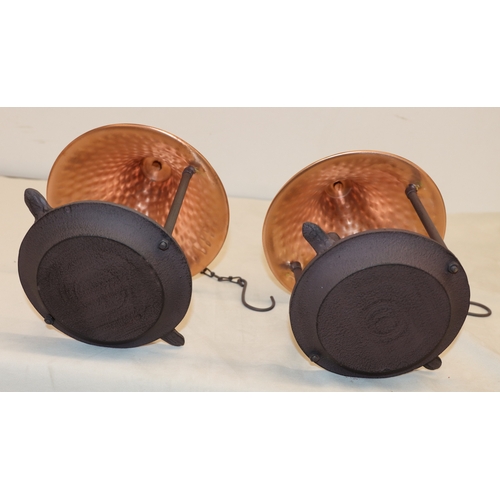 4101 - A pair of bird feeders with copper tops, 29cm high.