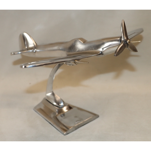 4111 - An alloy model spitfire, 17.5cm high, 21.5cm high.