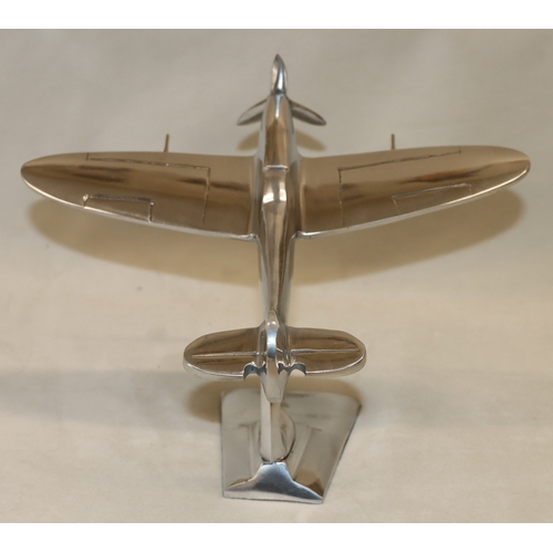 4111 - An alloy model spitfire, 17.5cm high, 21.5cm high.