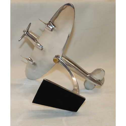 4111 - An alloy model spitfire, 17.5cm high, 21.5cm high.