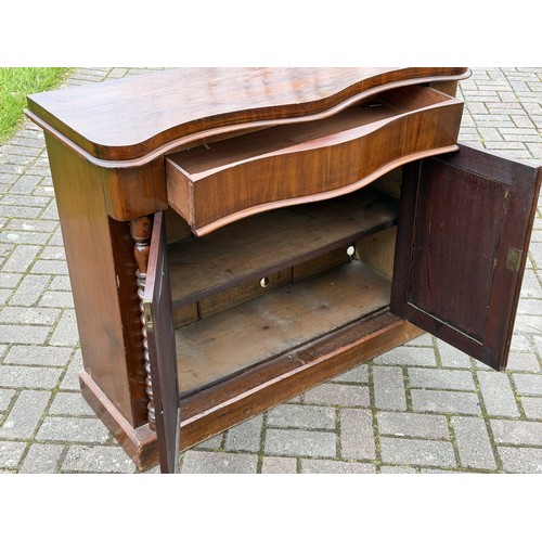 4092 - A 19th Century serpentine top cabinet over 1 long drawer and 2 panel doors, barley twist supports, 1... 