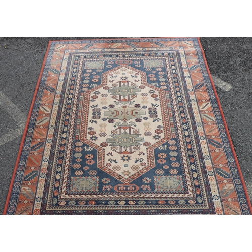 A machine-made wool rug 238 x 171cm (some wear to ends).