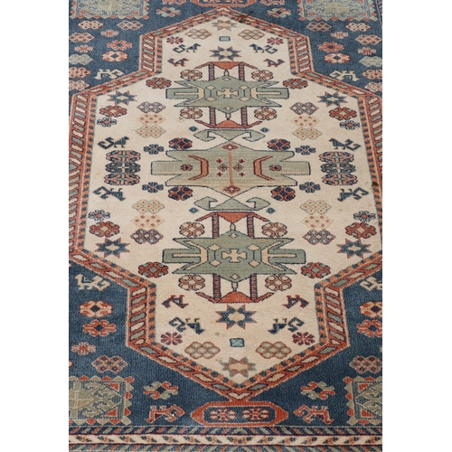 A machine-made wool rug 238 x 171cm (some wear to ends).
