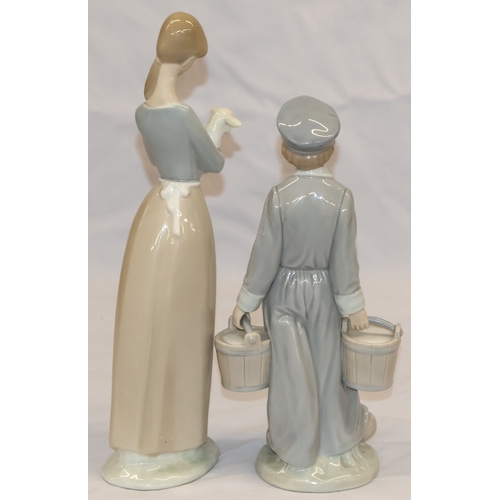 37 - 2 Lladro figurines; a Dutch boy carrying pails, 22cm high and a young girl holding a lamb, 27cm high... 